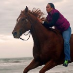 Riding like the wind on a Thoroughbred on the beach!
